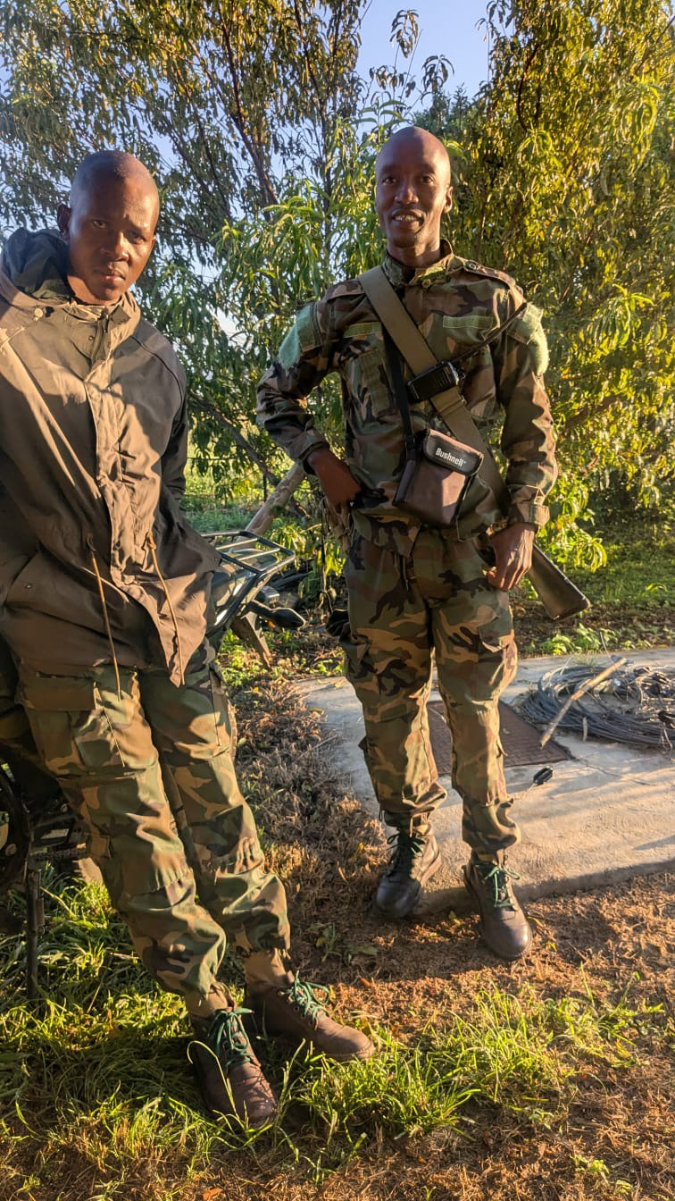 Two armed Nambiti rangers on a motorbike during patrol
