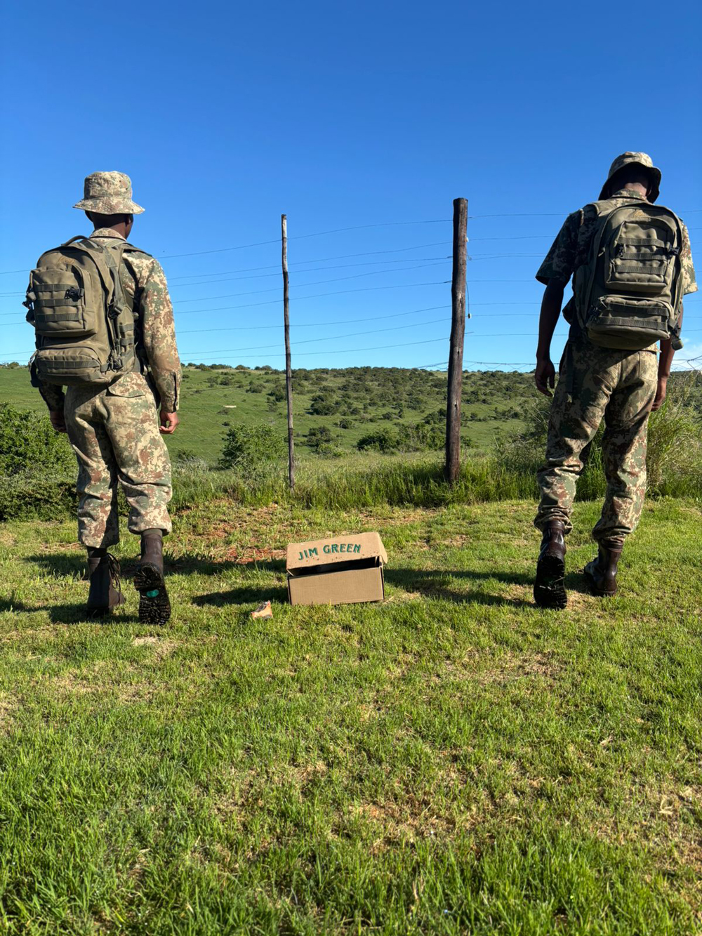 Two Addo rangers looking out over the national park fence line